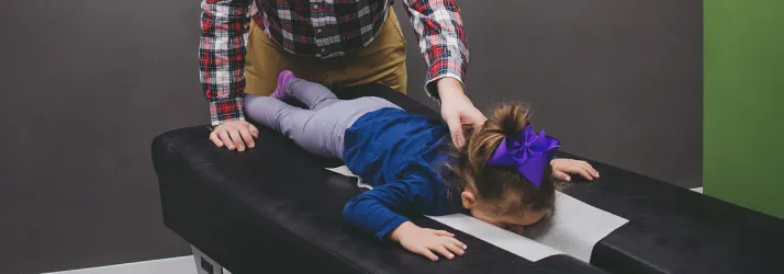 Chiropractor Fitchburg WI Kodi Schroeder Adjusting Child